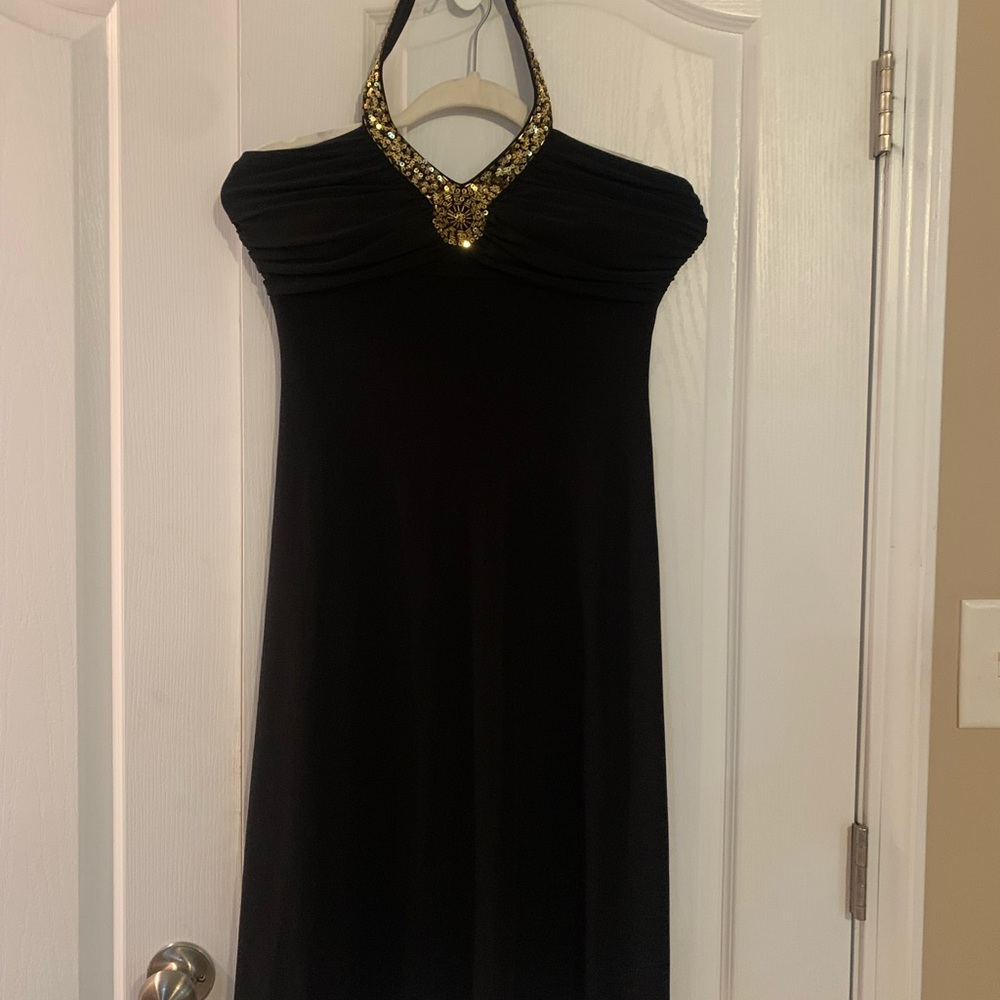 Ladies black  dress with gold in the middle and back out strap going over head